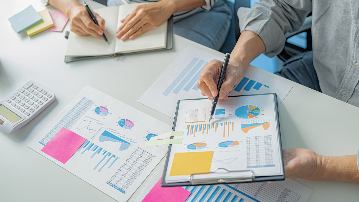 Team collaborating in front of a digital board